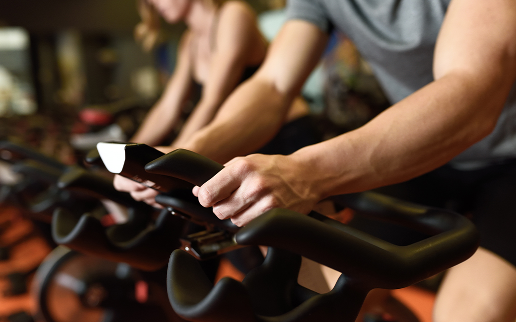 close up of spin bikes in a group fitness class